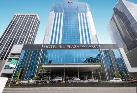 The impressive facade of Hotel Riu Plaza Panama towering over the financial district.