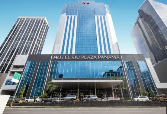 The impressive facade of Hotel Riu Plaza Panama towering over the financial district.